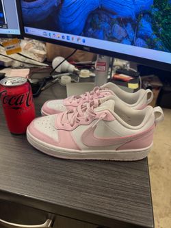 Nike Court Borough Low 2 SE sneakers feature a durable white and pink leather design with a classic court style
