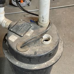 Sump Pump with Discharge Pipe