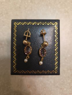 10 k gold earrings.  Weight is 1.9 grams