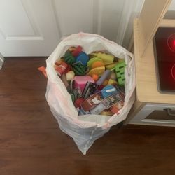 Ikea Play Kitchen With A Bag Of Assorted Plastic Fruits And Vegetables