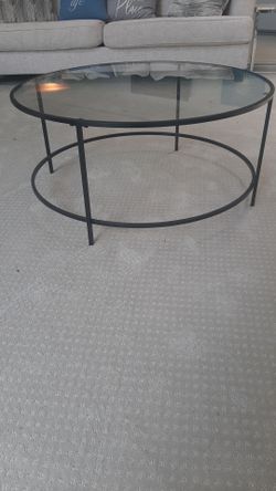 Round glass top coffee table