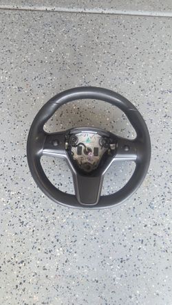 Tesla stock steering wheel.
