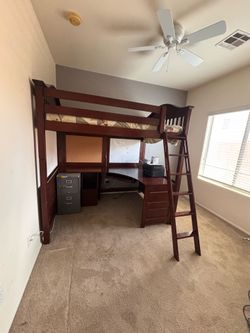 Bunk bed with office desk and ladder
