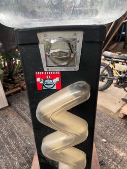 Vintage bounce ball beaver quarter machine