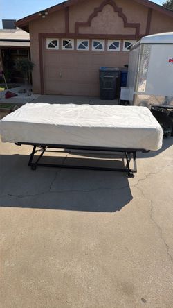 TEMPUR-PEDIC twin mattress with a base