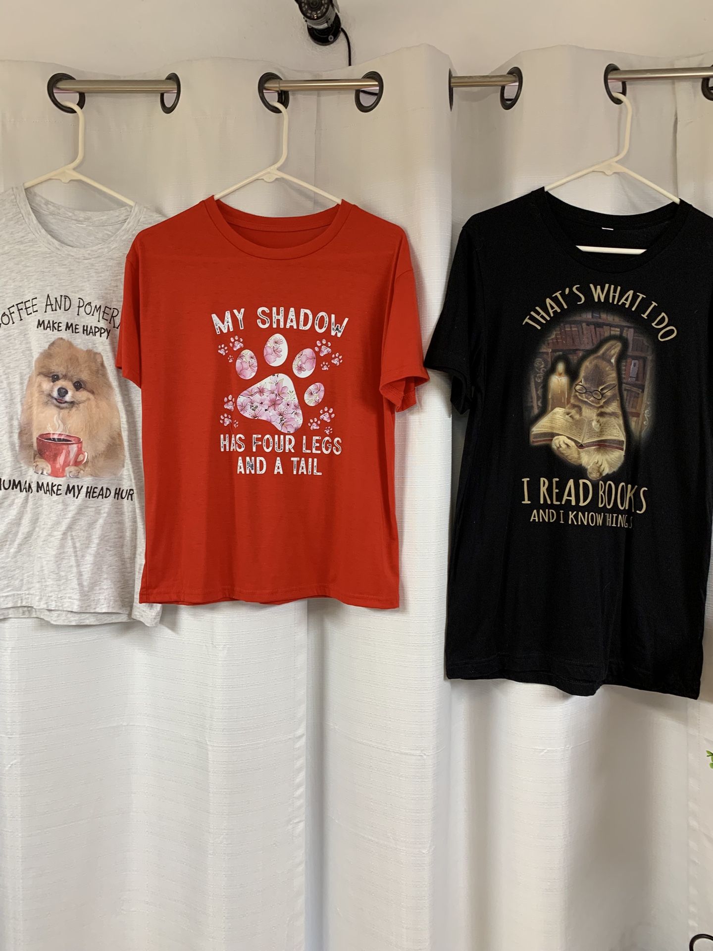 Red, Black, And Grey T-shirt’s With Messages On Them 