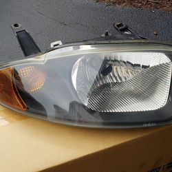 2003 to 2005 chevy Cavalier Left  & right side headlight assembly