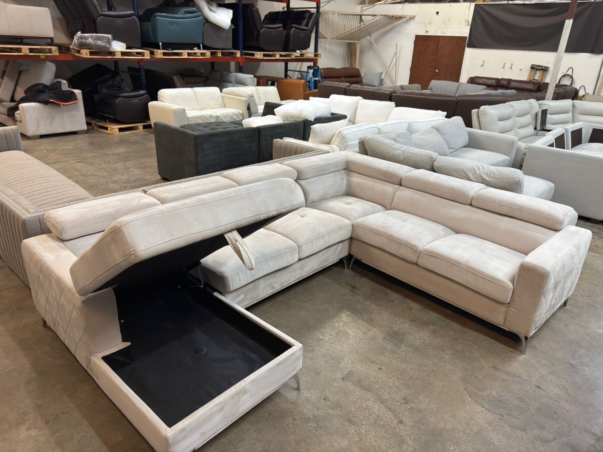 Fabric sectional couch with storage chaise.