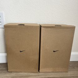 2 nike calm slides , white and pink