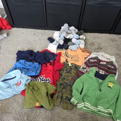 Baby Clothes And A Bunch Of Baby/Toddler Socks