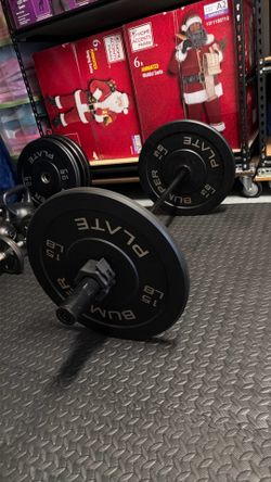 100lbs worth of bumper plates and two curling bars