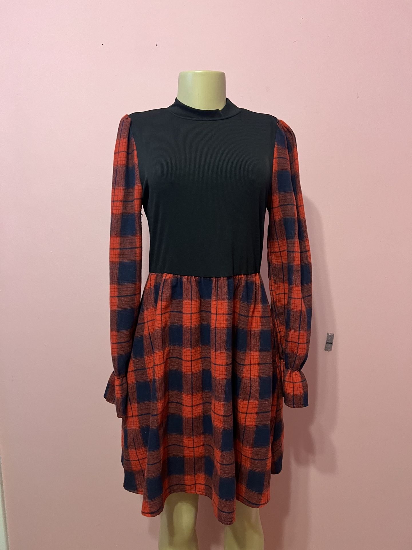 Chic dress with a black top and red checkered skirt