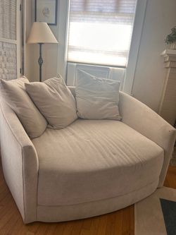Swivel Cuddler Chair - Living Spaces