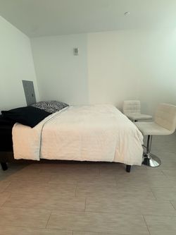 Queen bed and bar stool chairs