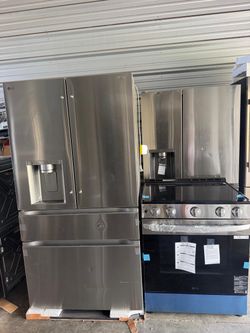New LG counter depth 4-door refrigerator and new LG slide stove.