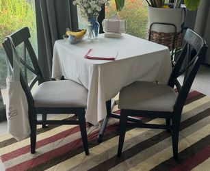 Small dining table with two chairs
