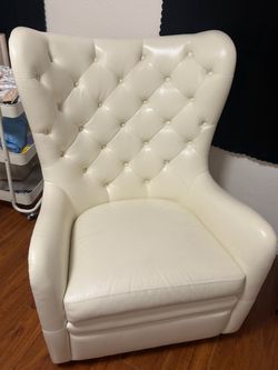 White leather rocking and swivel chair