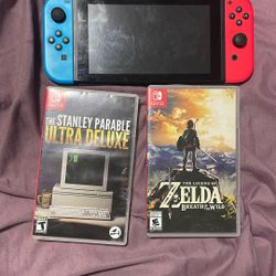 Nintendo Switch And Two Games