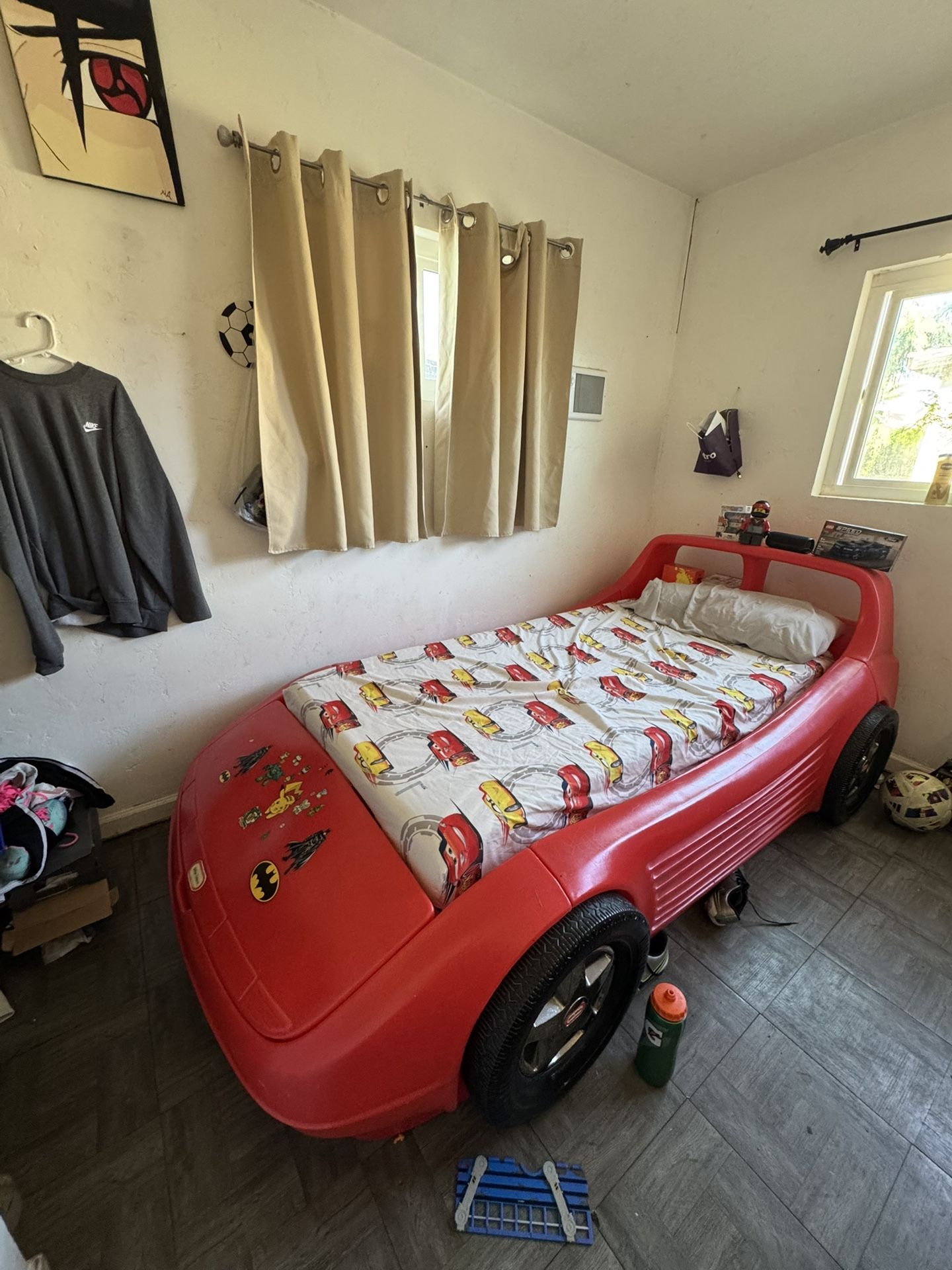 Twin size race car bed little tikes red plastic. Good condition.