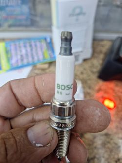 Spark Plugs NEW IN BOX BMW 4 PIECES 80 DOLLARS