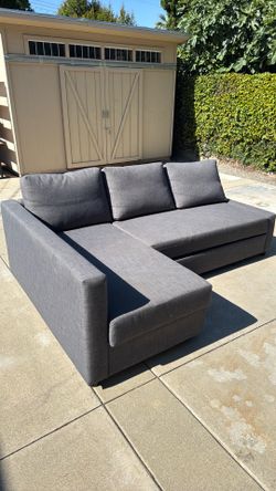 Couch with roll out ottoman bed