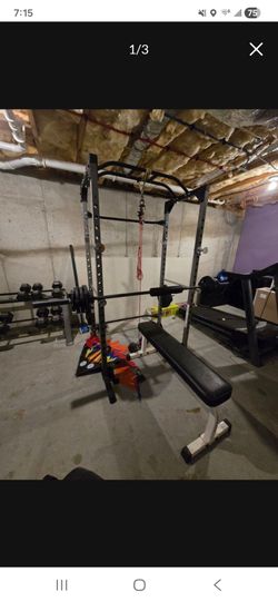 Power Squat rack with bar and flat bench.