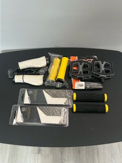 BIKE GRIPS , PEDALS AND CHAINS /  NEW