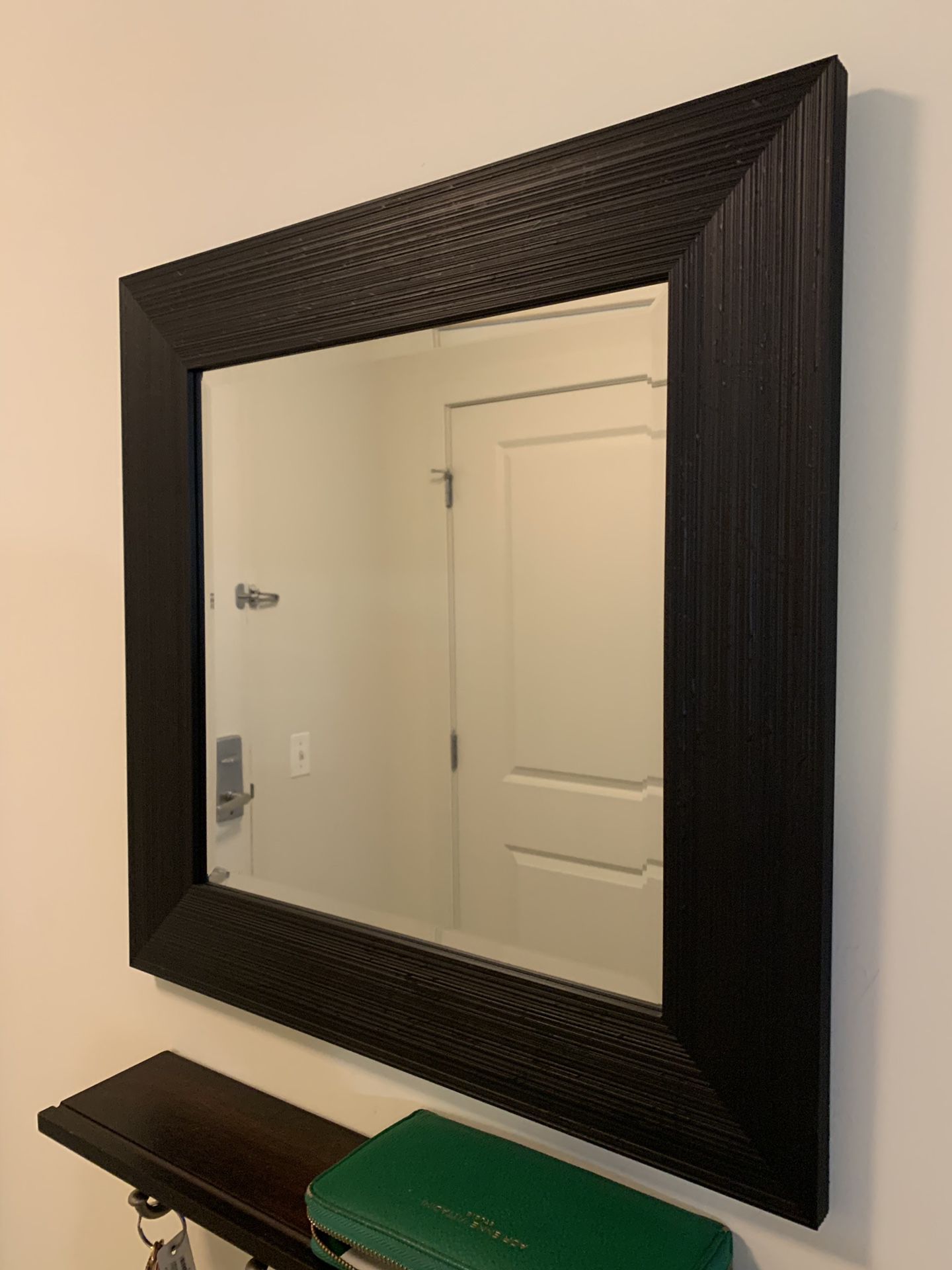 Dark brown framed mirror