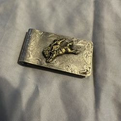 Montana Silversmiths Western-style money clip featuring a gold-plated bucking horse/bronco emblem