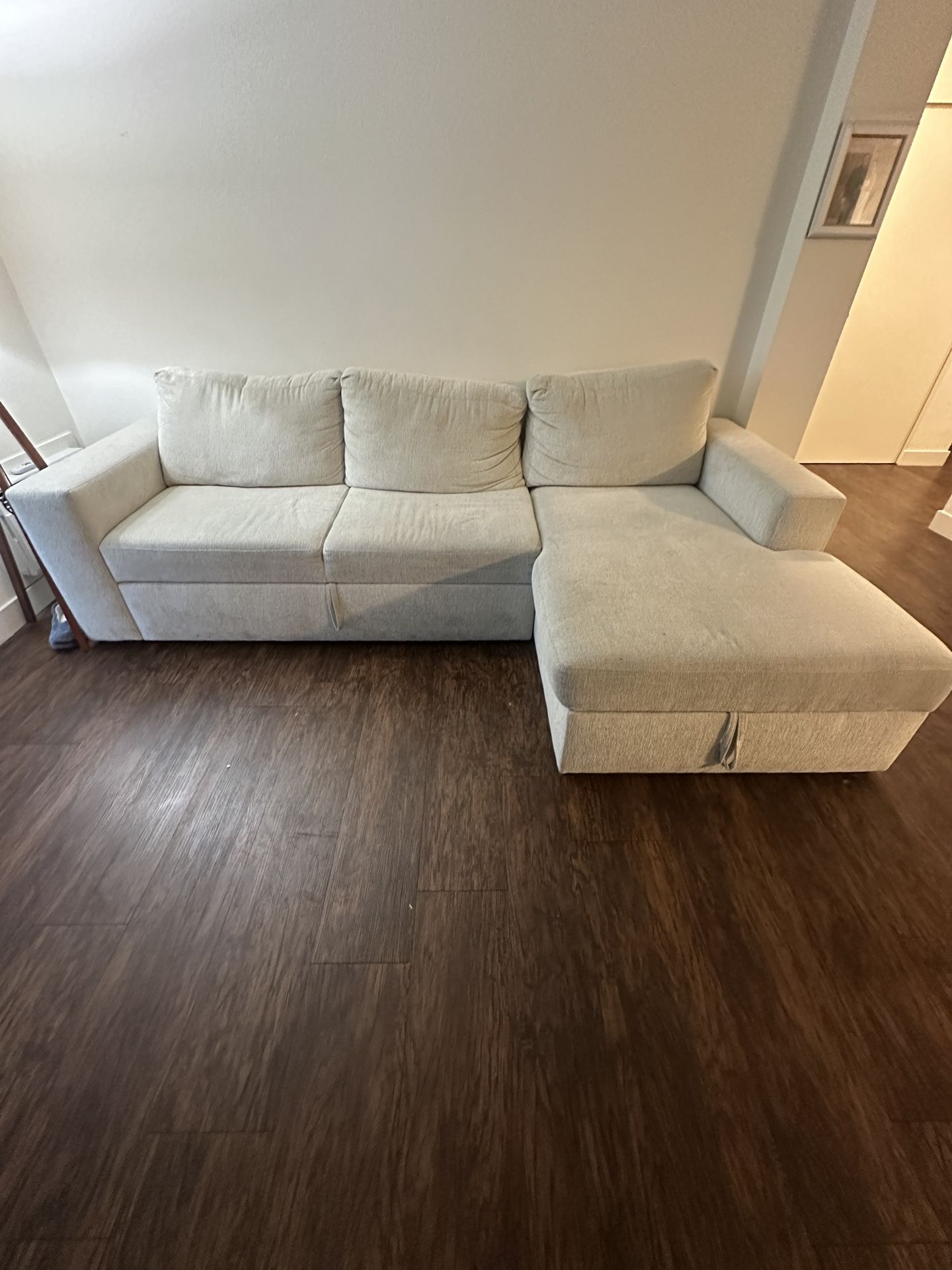 Living Spaces Sebastian Cream White Sleeper Sectional