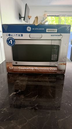 GE 1.1-cu ft 950 -Watt Countertop Microwave ( Stainless Steel )