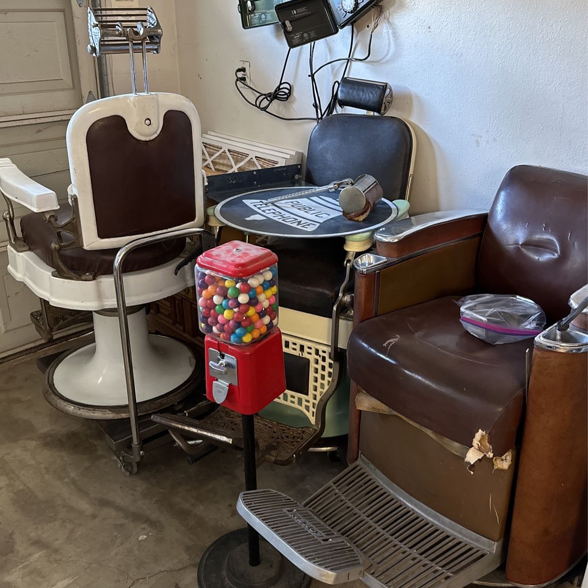 Full Three Barber chair Setup With Wall Full Of Antiques. 