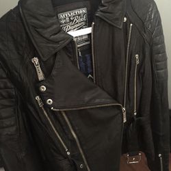 Women’s Black Affliction genuine leather jacket.