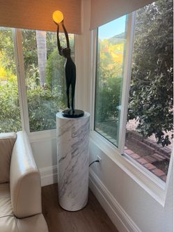 Elegant statement piece that combines art and lighting in one stunning design.