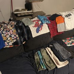 Boys Size 5 Boys And Size 6  Youll Get 2 Button Up Shirts,7 Shorts 8 T-shirts And One. PJ Botoms 