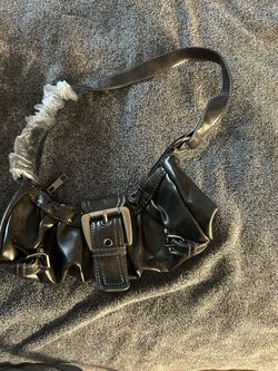 This is a black faux-leather buckle hobo shoulder bag in a Y2K style