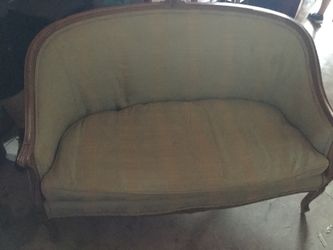 Antique love seat needs reupholstered but wood work in excellent shape