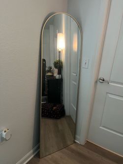 Golden arched mirror