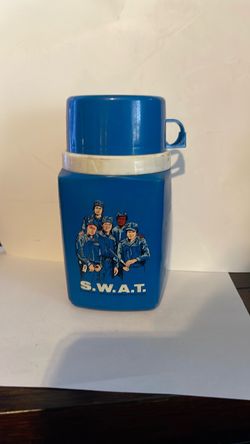 The vintage 1975 S.W.A.T. plastic thermos was manufactured by King-Seeley Thermos Co.