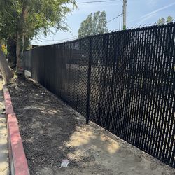 Chain link fences color black with privacy slats