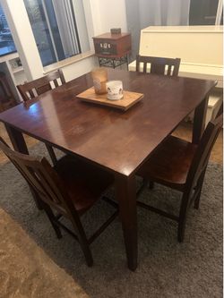 Wood table with four chairs