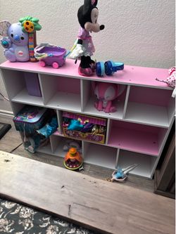 Pink and white shelves for kids