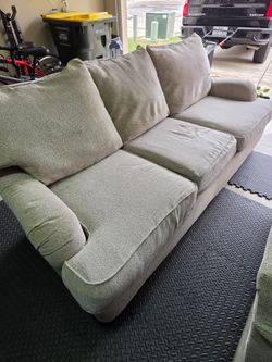 Upholstered oversized chair, couch and plaid chair