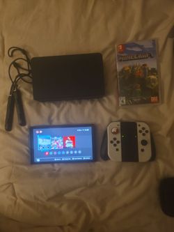 Nintendo switch oled  bundle  with 4 games
