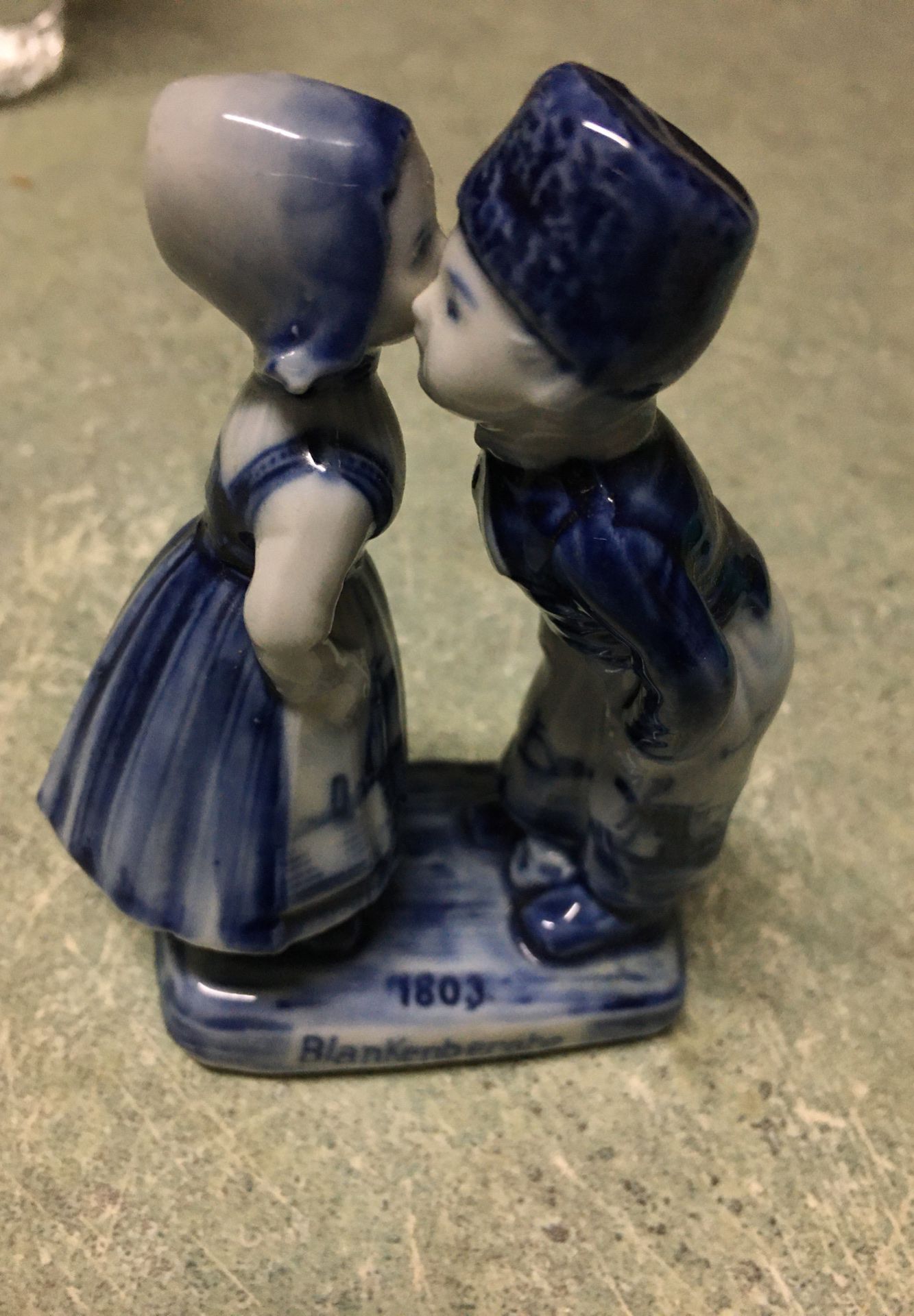 Delft style Porcelain figure of boy and girl kissing