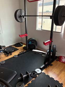Squat rack, Olympic barbell, plates and rubber padding