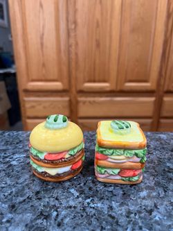 Vintage Ceramic Hamburger & Sandwich Pair of Salt and Pepper Shakers.  Size approximately 2 1/4 inches tall.  Preowned.  Has been on display in a cabi