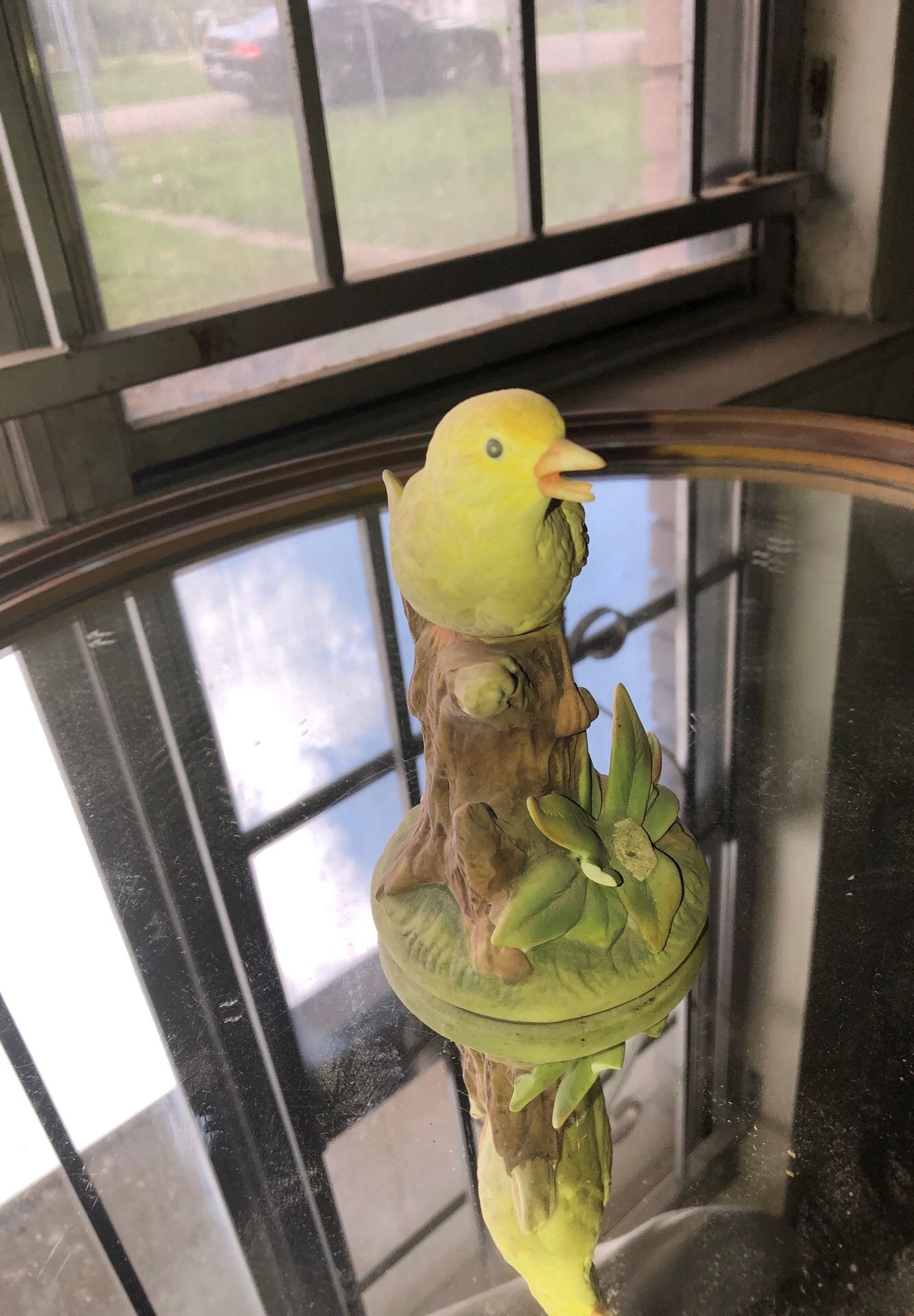 Collectible antique yellow bird statue