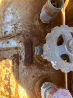 Old Rusty Metal Tank with Valves