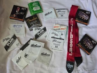Guitar Strings and Guitar strap/ A variety of different Strings this is a GREAT DEAL